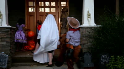 stock-footage-children-in-halloween-costumes-trick-or-treating